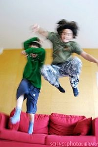 Hyperactive children bouncing on the sofa